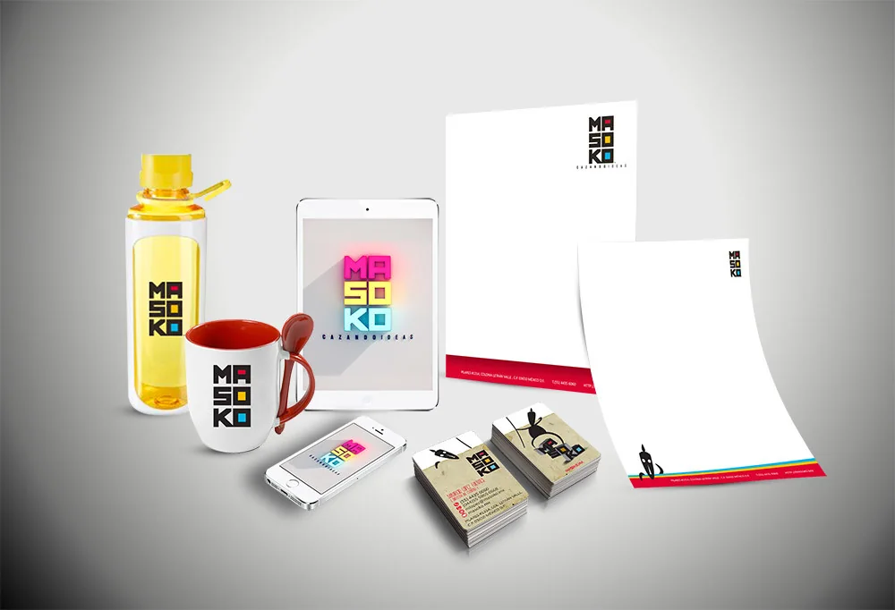 The Masoko brand applied to letterhead, two business card designs, a mug, a bottle and screen mockups
